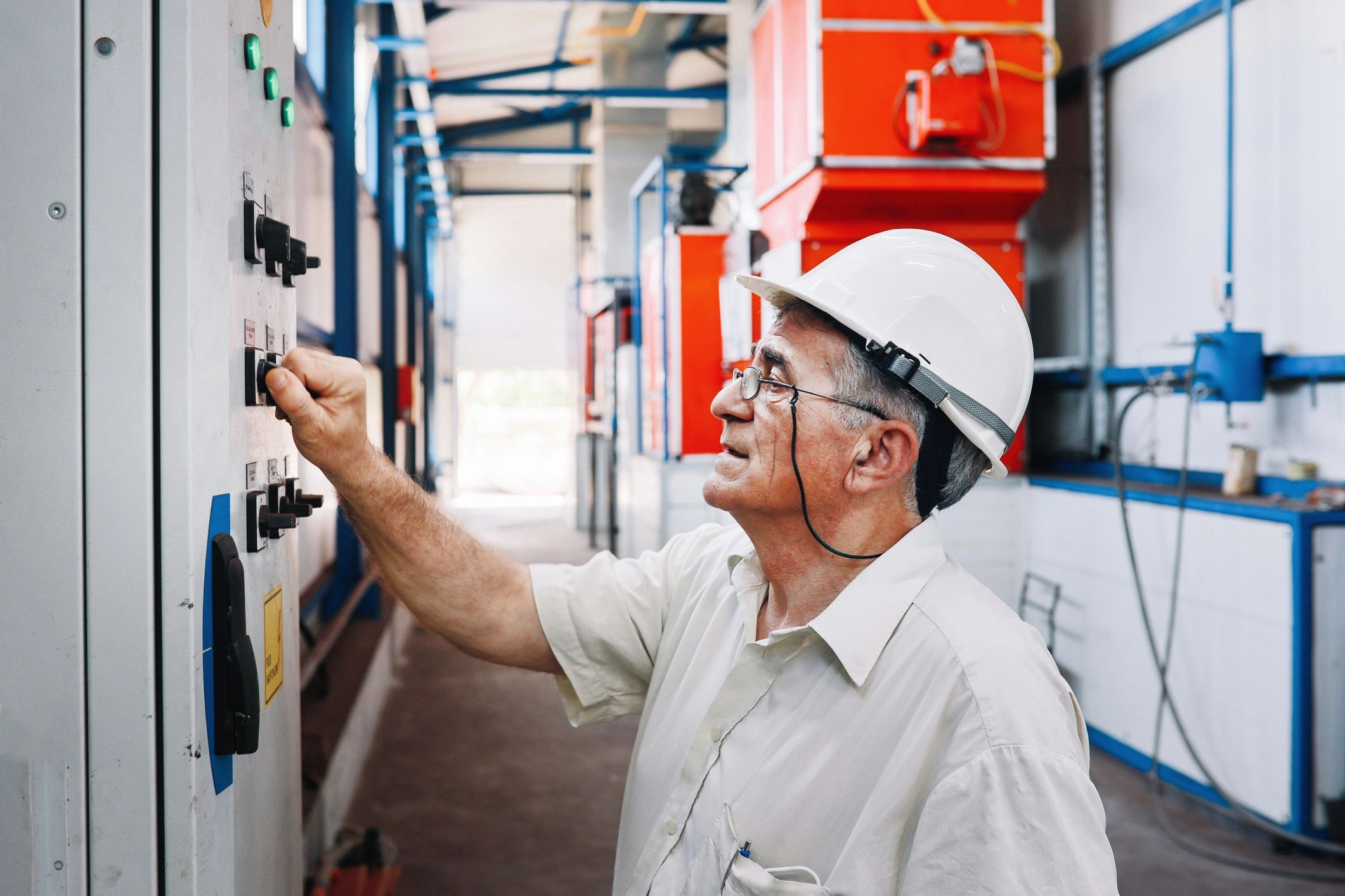 Technician working on industrial electrical equipment