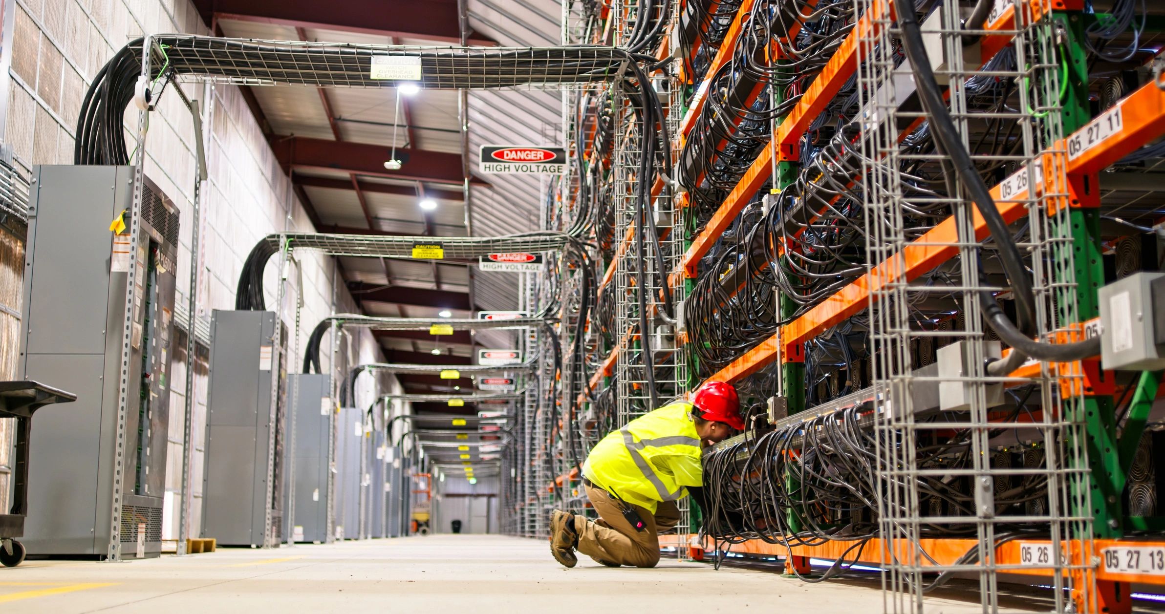 Technician working in an industrial data center environment