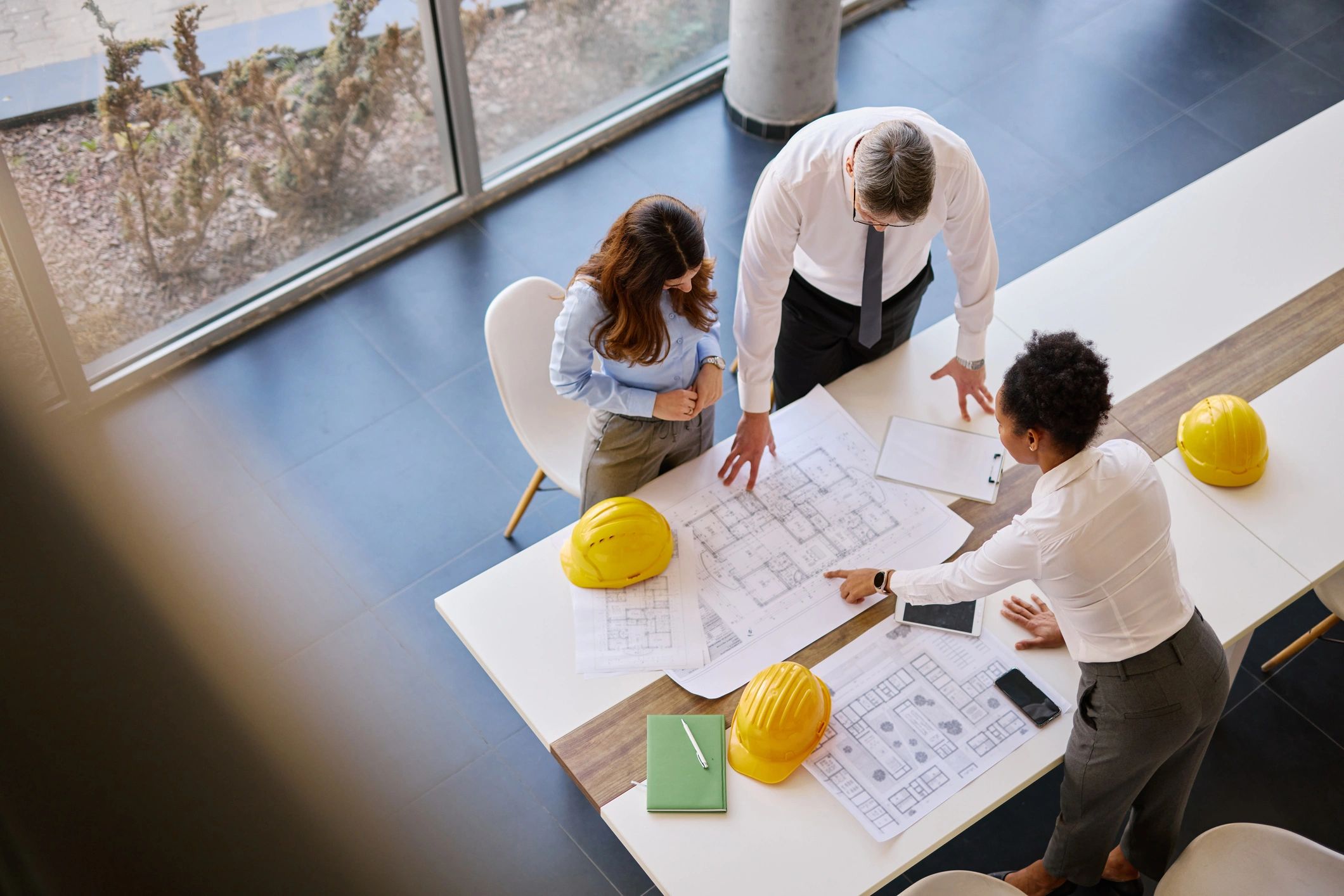 Engineering team reviewing plans and drawings